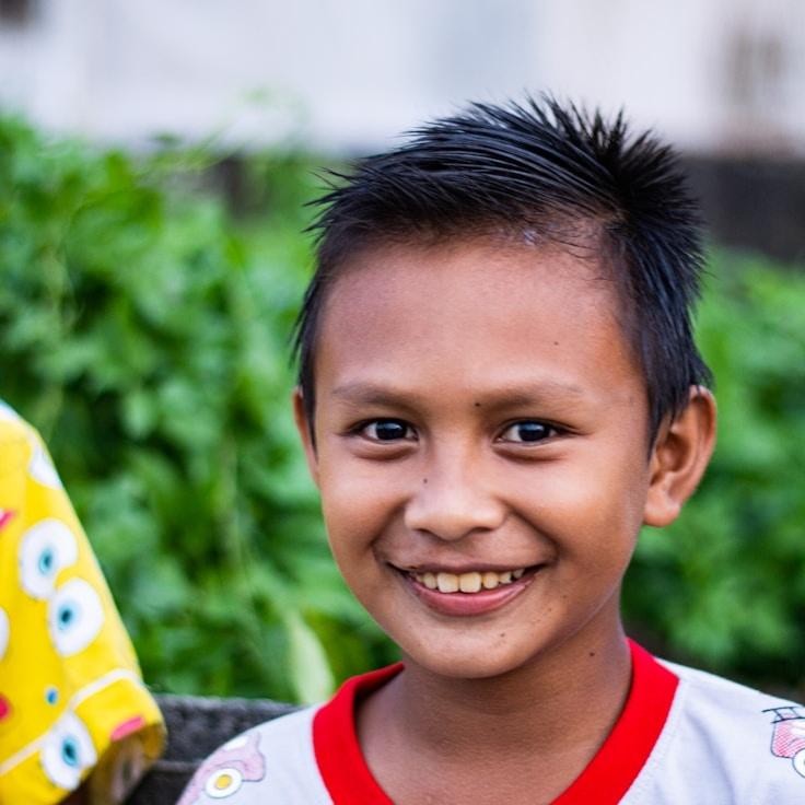 Alex Kim, Lead Design Curator at StarMoonCloud, reviewing corporate floral arrangements